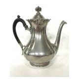 Stamped ornate tea pot with wood handle