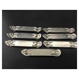 Seven vintage Strohs beer bottle openers