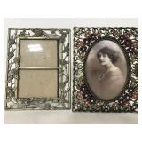 Two metal picture frames