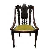 Antique carved wood chair w/ green velvet seat