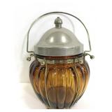 Vintage amber glass jar with metal musical lid