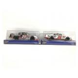 Two Nascar #29 cars in boxes