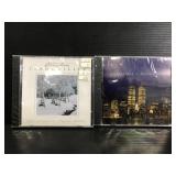 Two sealed Christmas CDs