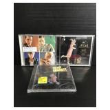 Three assorted CDs unopened