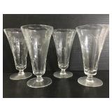 Set of four etched footed glasses