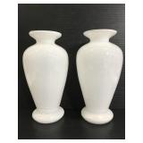 Two matching white glass vases
