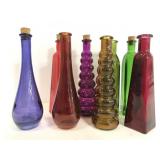 Vintage collection of eight colored glass bottles