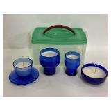 Handmade blue glass candles in container
