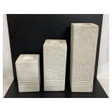 Trio of large plaster candle holder pillars