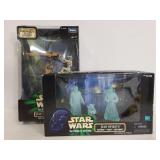 Two Star Wars figure toys in boxes