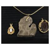 Three handmade precious stone pendants