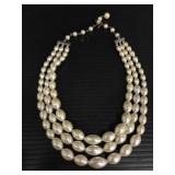 Triple strand pearl necklace