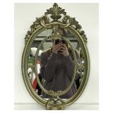 Gold tinted gilded wall hanging mirror