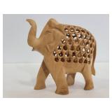 Wood carved pregnant elephant