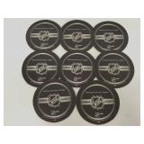 Eight black NHL official coasters