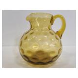 Small yellow glass pitcher