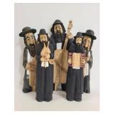 Carved wood men playing instruments figures