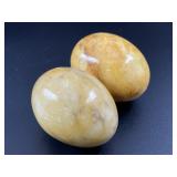 Pair of yellow marbled stone eggs