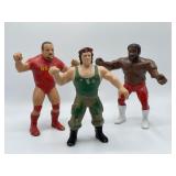 Three vintage professional wrestling figures