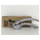 The Pampered Chef garlic press with box