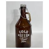 Cold beer served here large brown glass growler