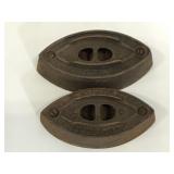 Pair of cast iron AC Williams Co. irons- two sizes