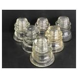 Six large vintage glass insulators