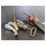 Collection of vintage oil cans and oilers