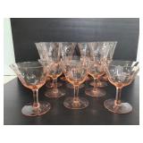 Twelve etched pink stemware glasses