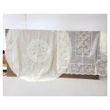 Two vinyl lace table cloths