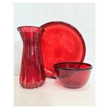 Red glass plate, bowl and vase