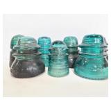 Seven blue glass insulators