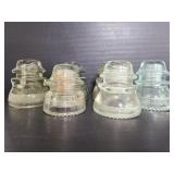 Six clear glass insulators