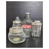 Seven glass jars and bottles