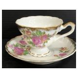 Gold trimmed and floral teacup and saucer