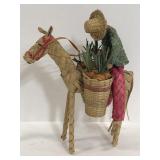 Handmade woven farmer riding horse
