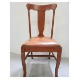 Vintage wood chair with leather upholstery seat