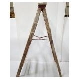 Paint covered wood ladder with carry handle