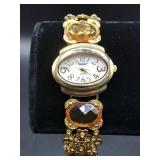 POV gold and amber stone watch