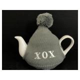 White ceramic teapot in XOX sweater