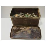 Vintage aluminum box with beach rocks and shells