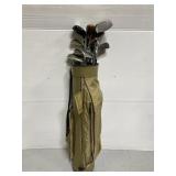 Assorted golf clubs in vagabond golf bag