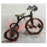 Vintage Mercury red tricycle w/ string lights