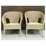 Pair of cream painted braided wicker arm chairs