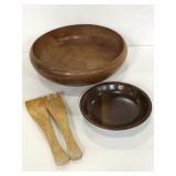 Wooden salad bowls with serving utensils