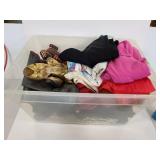 Bin of assorted clothing and shoes