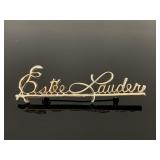 Estée Lauder sales rep pin