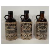 Three Mississippi Mud glass beer growlers