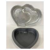 Pair of heart shaped metal baking pans