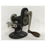 Vintage cast iron Singer hand crank pinker